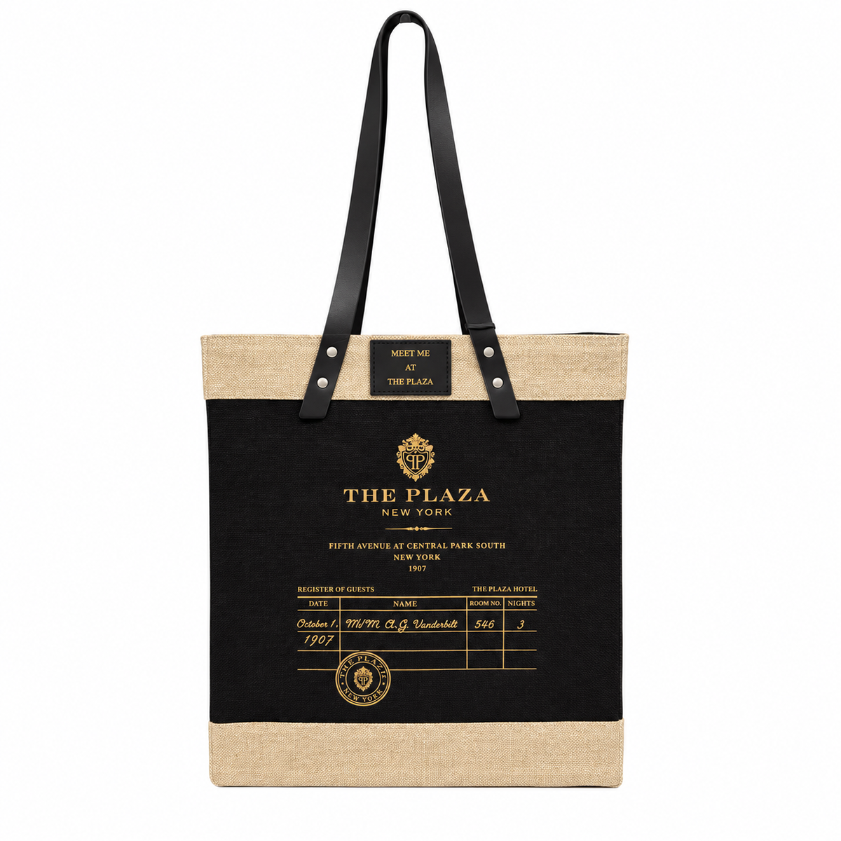 A tote bag styled like a vintage hotel check-in slip, featuring a black central panel with gold text reading 'THE PLAZA NEW YORK' and a beige jute top and bottom trim, with black shoulder straps.