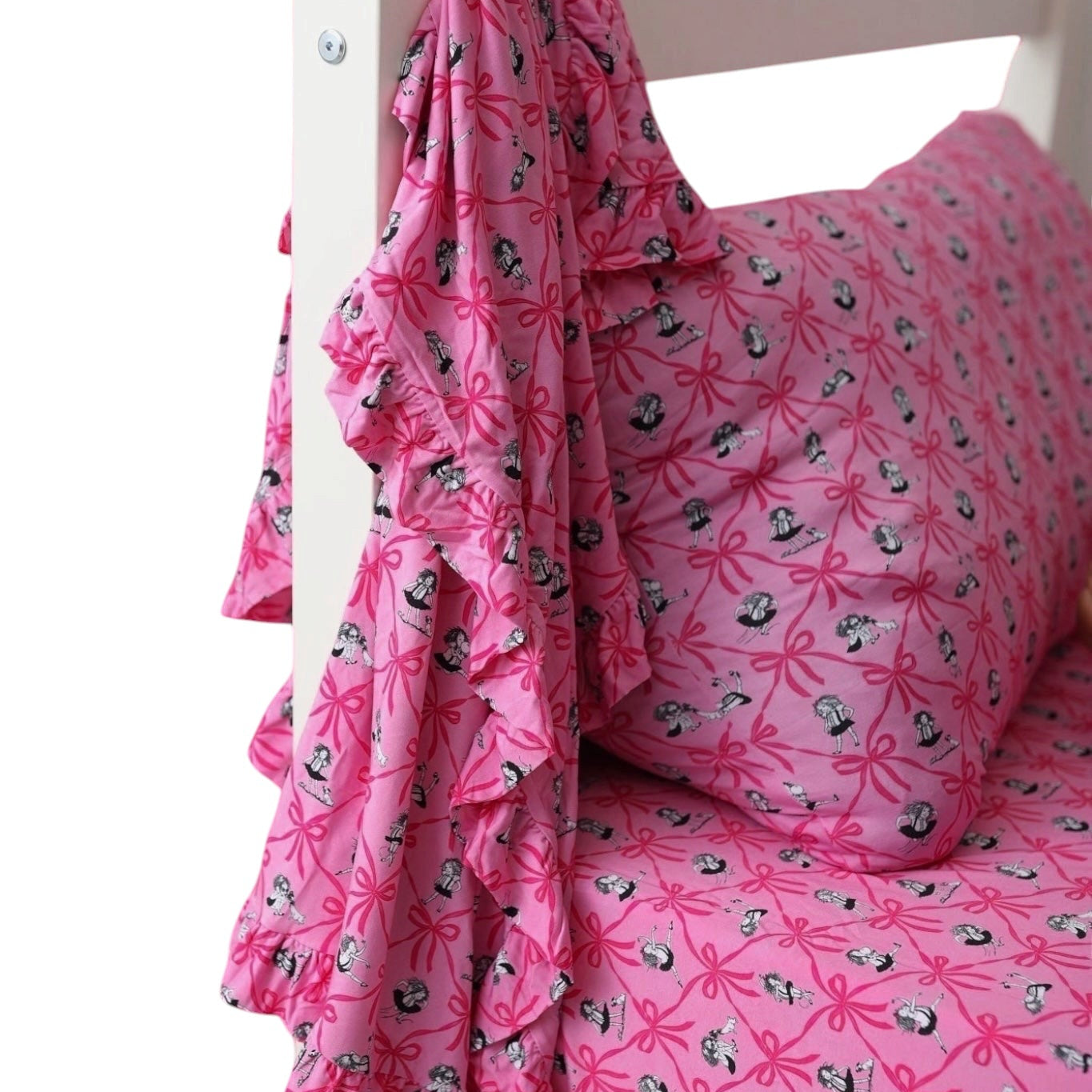 Pink bedding set with a matching ruffled throw blanket and pillowcase, featuring a black and white panda print, draped over a white wooden bed frame against a white background.