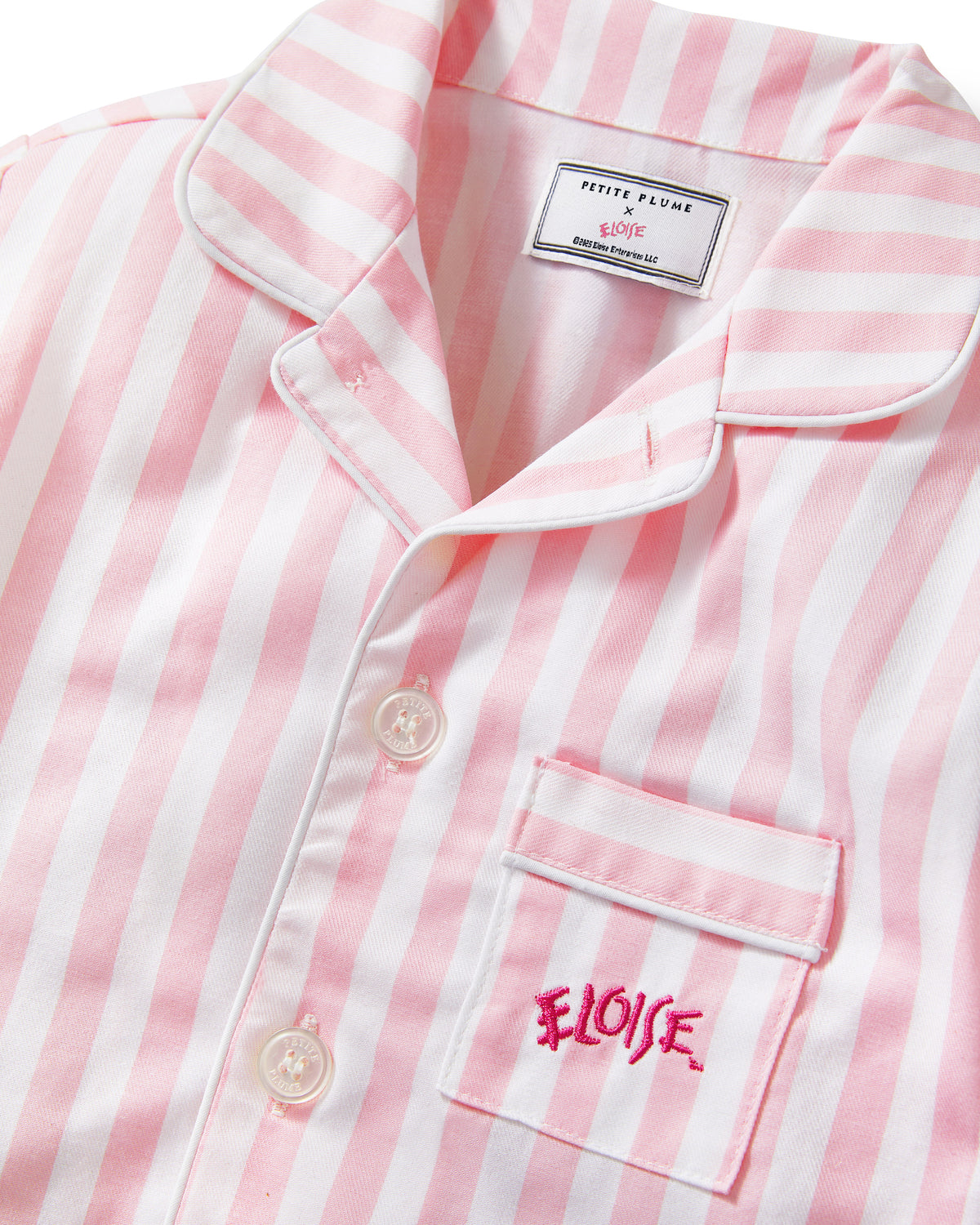 Pink and white vertically striped short-sleeve pajama shirt with a collar, button front, and a chest pocket embroidered with the word 'ELOISE'.